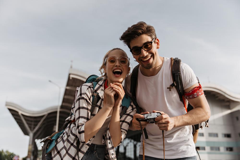 Cheerful,Brunette,Man,And,Woman,In,Sunglasses,Look,Happy,And