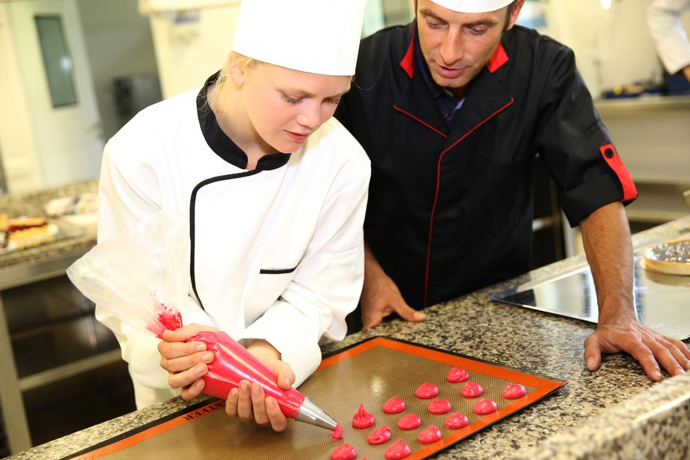 Student,In,Pastry,Making,Cookies,With,Help,Of,Teacher